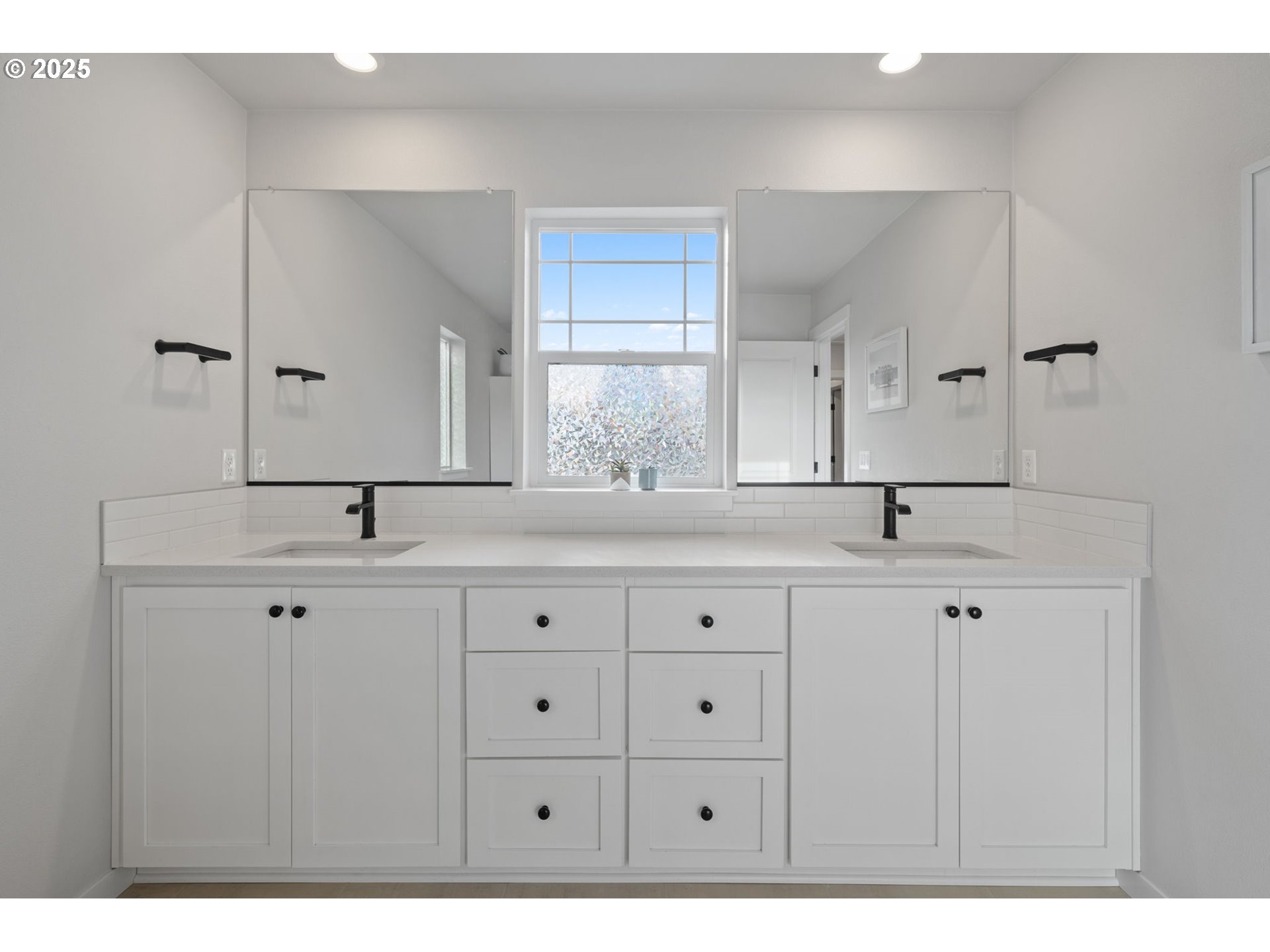 16719 Southwest Beemer Lane Portland, OR 97224 - Photo 24 of 47 a bathroom with double sink and a mirror