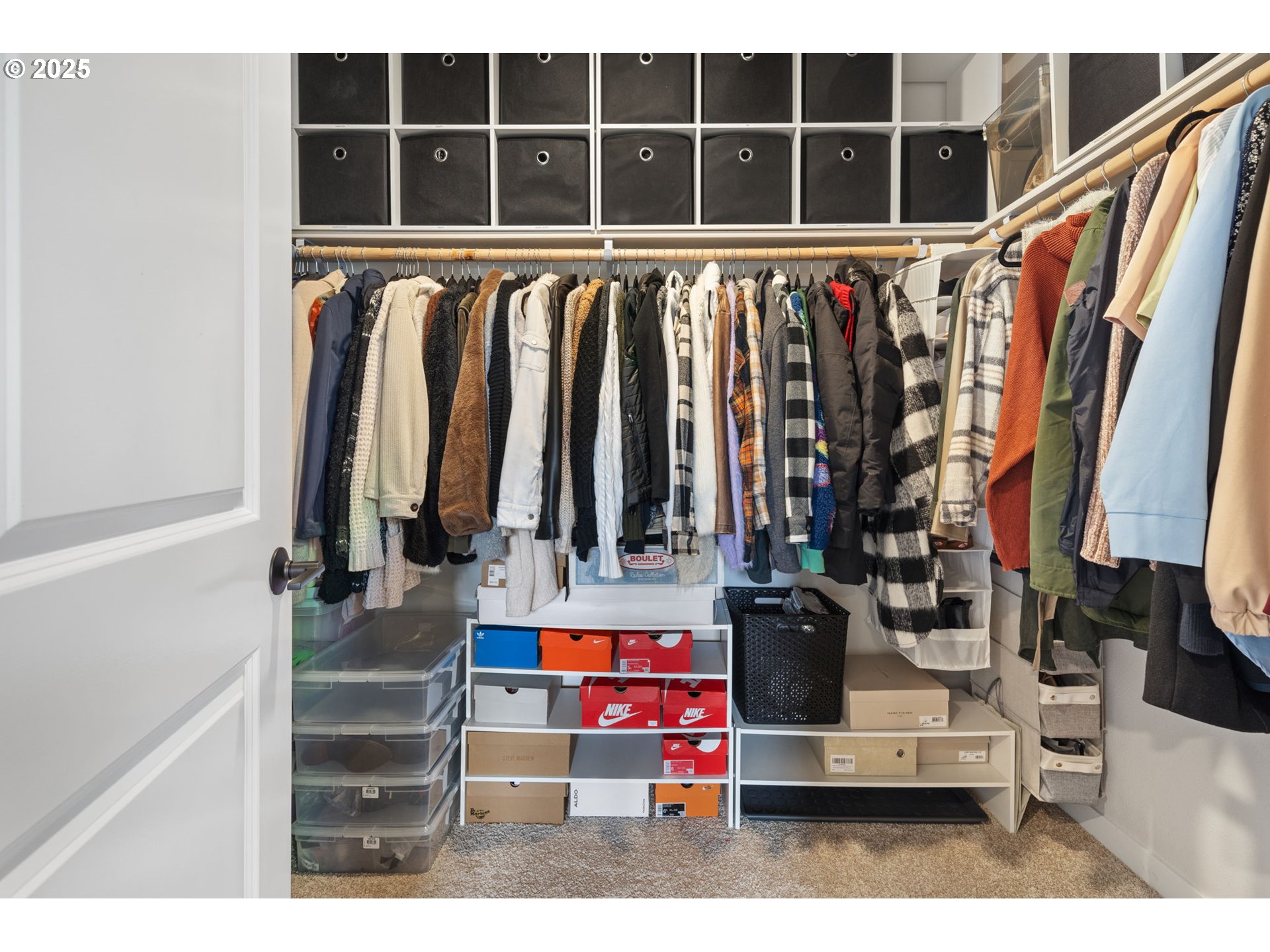 16719 Southwest Beemer Lane Portland, OR 97224 - Photo 26 of 47 a view of walk in closet with clothes and shoes