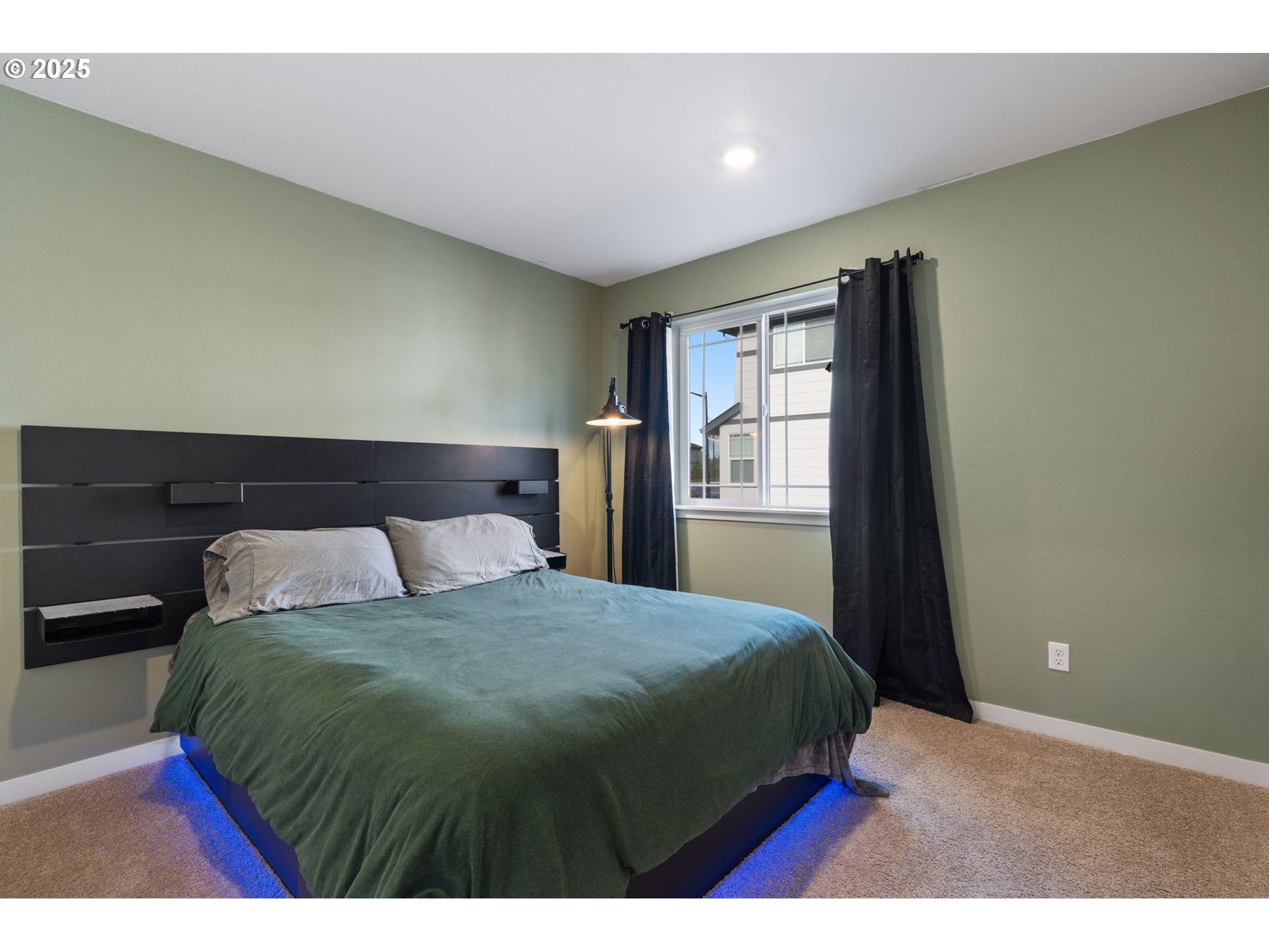 16719 Southwest Beemer Lane Portland, OR 97224 - Photo 27 of 47 a bedroom with a bed and wooden floor