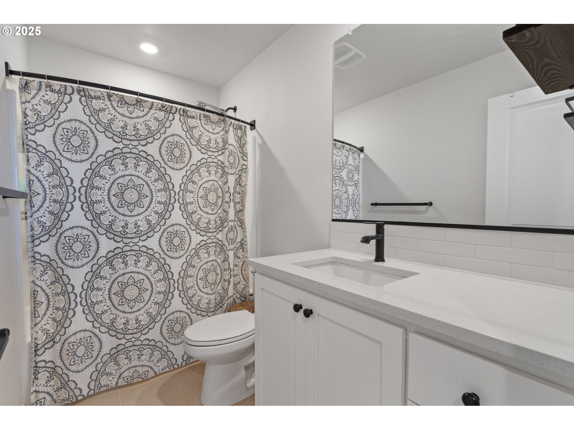 16719 Southwest Beemer Lane Portland, OR 97224 - Photo 29 of 47 a bathroom with a sink and a mirror