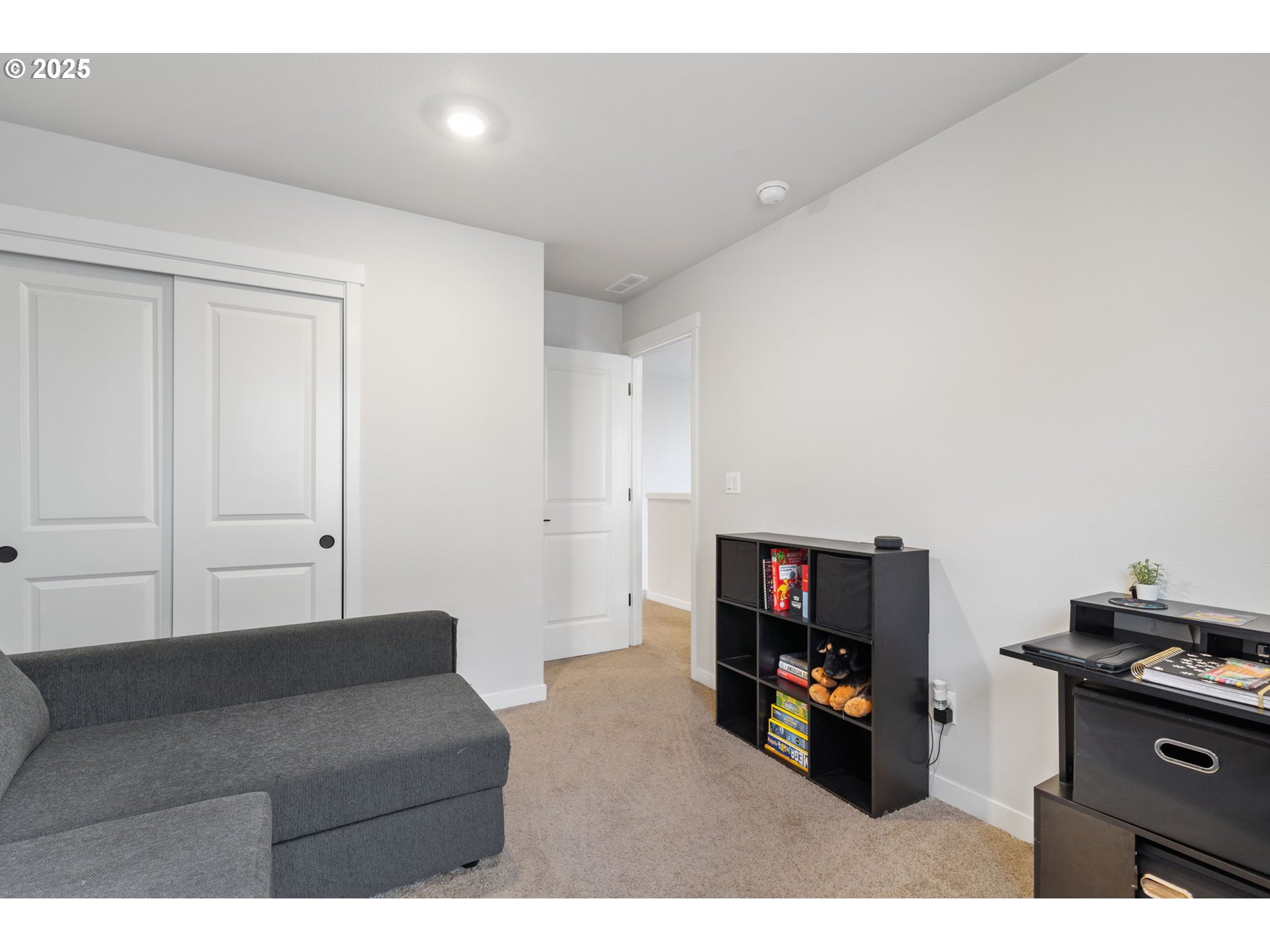 16719 Southwest Beemer Lane Portland, OR 97224 - Photo 31 of 47 a living room with furniture and a flat screen tv