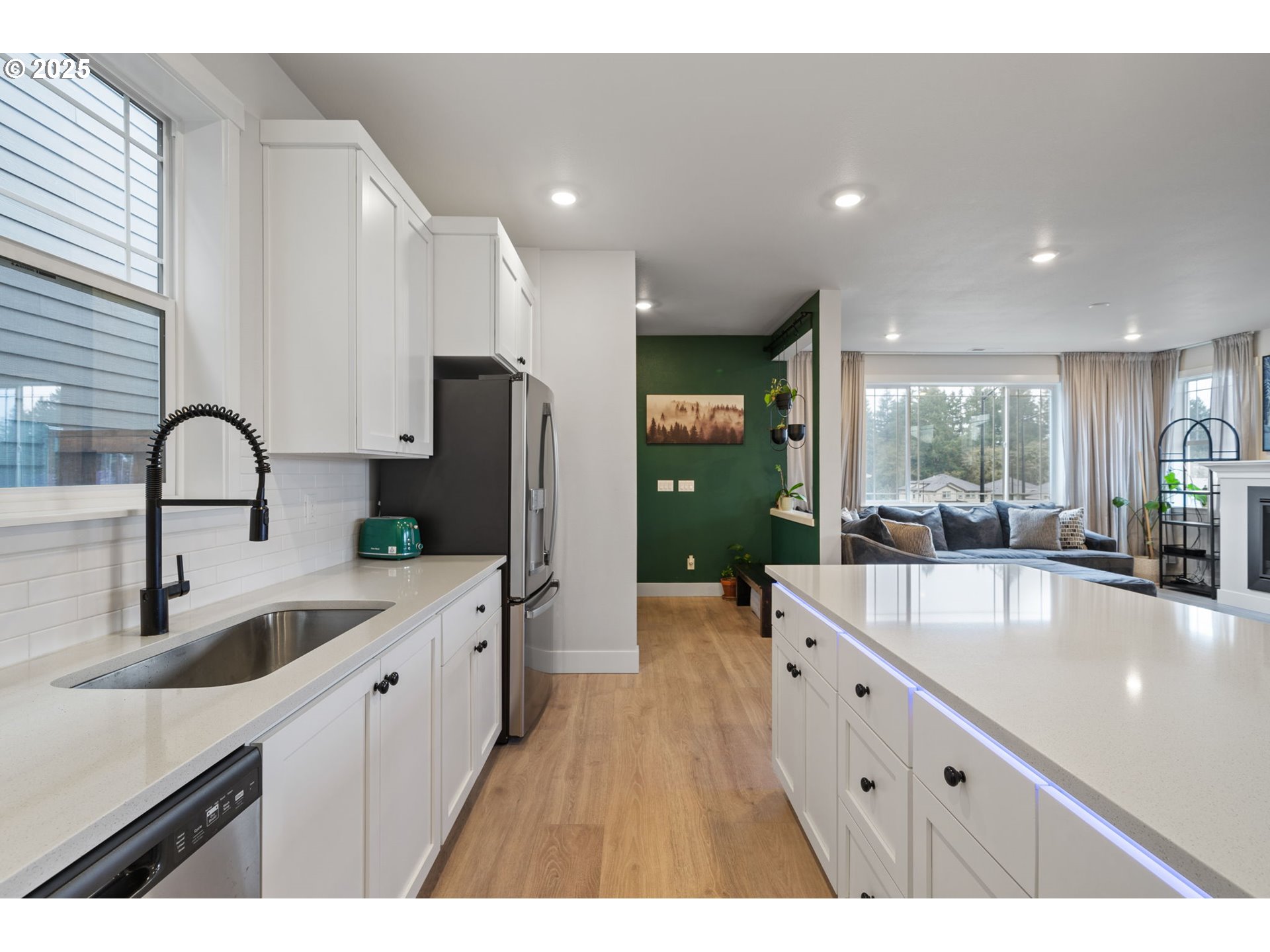 16719 Southwest Beemer Lane Portland, OR 97224 - Photo 10 of 47 a large kitchen with kitchen island a sink stainless steel appliances and cabinets