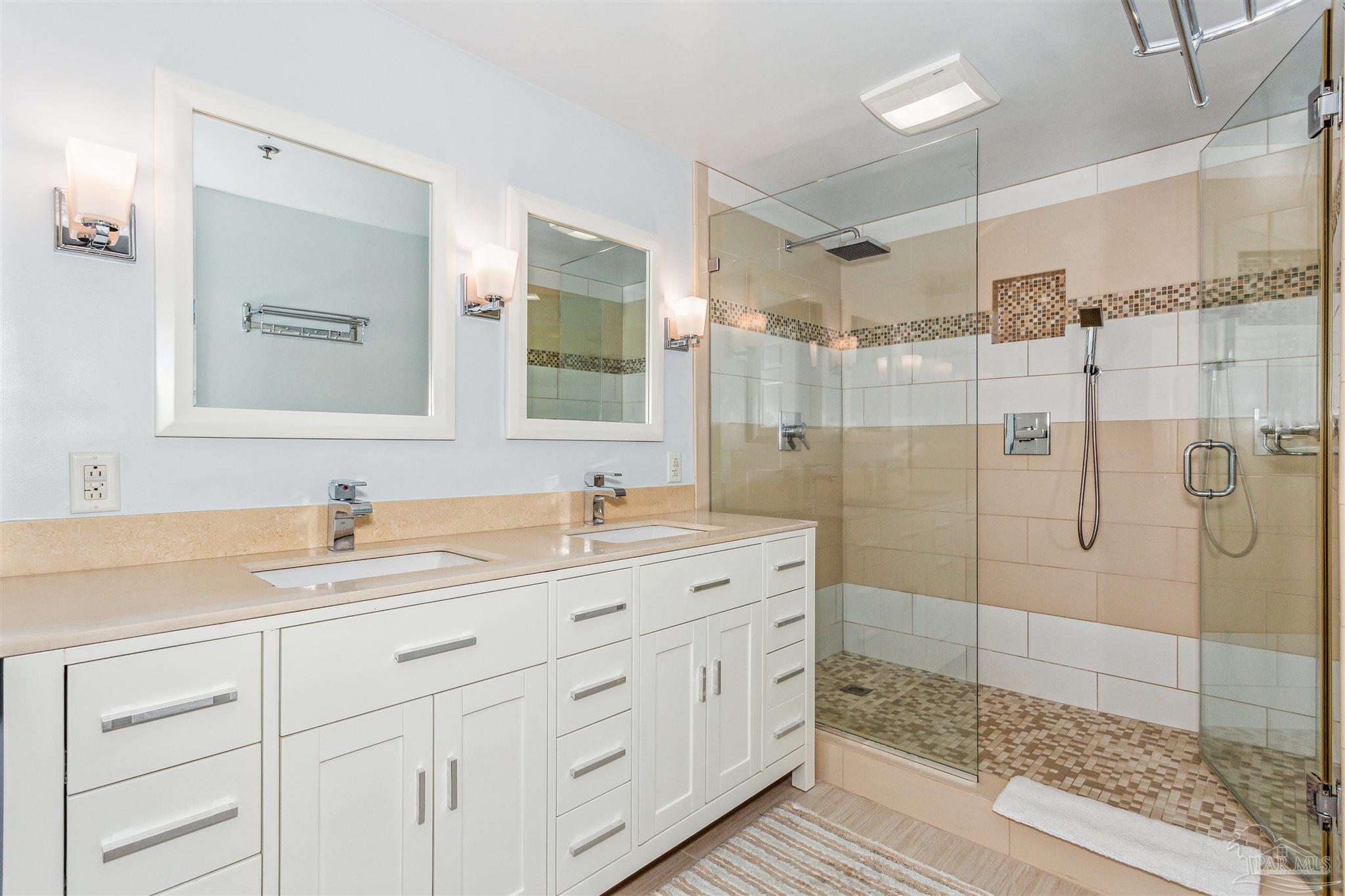 800 Fort Pickens Road, Unit 204 Pensacola Beach, FL 32561 - Photo 25 of 45 a bathroom with a shower sink and mirror