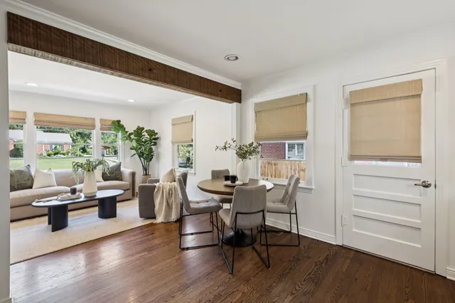 a view of a dining room with furniture window and wooden floor