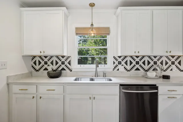 a kitchen with a sink and a window