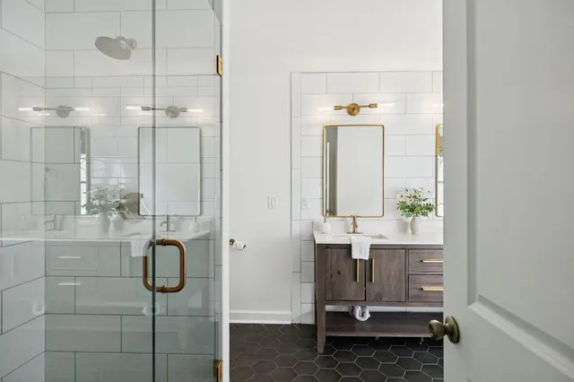 a bathroom with a shower and a sink