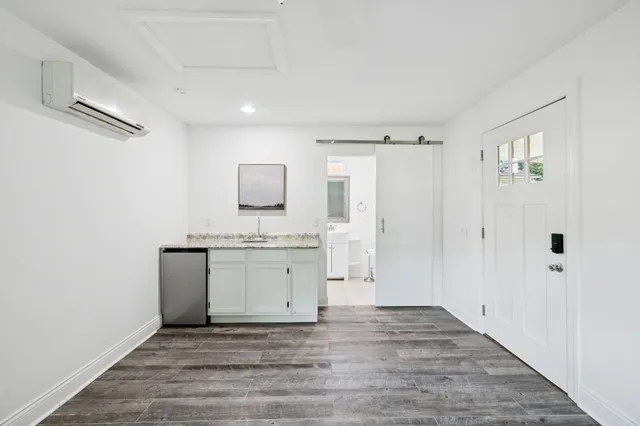 a view of a kitchen with a sink and dishwasher