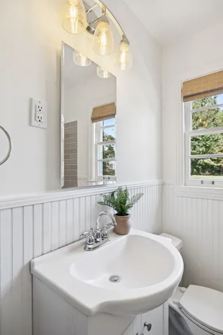 a bathroom with a sink and a window