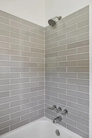 a bathroom with a sink and a shower