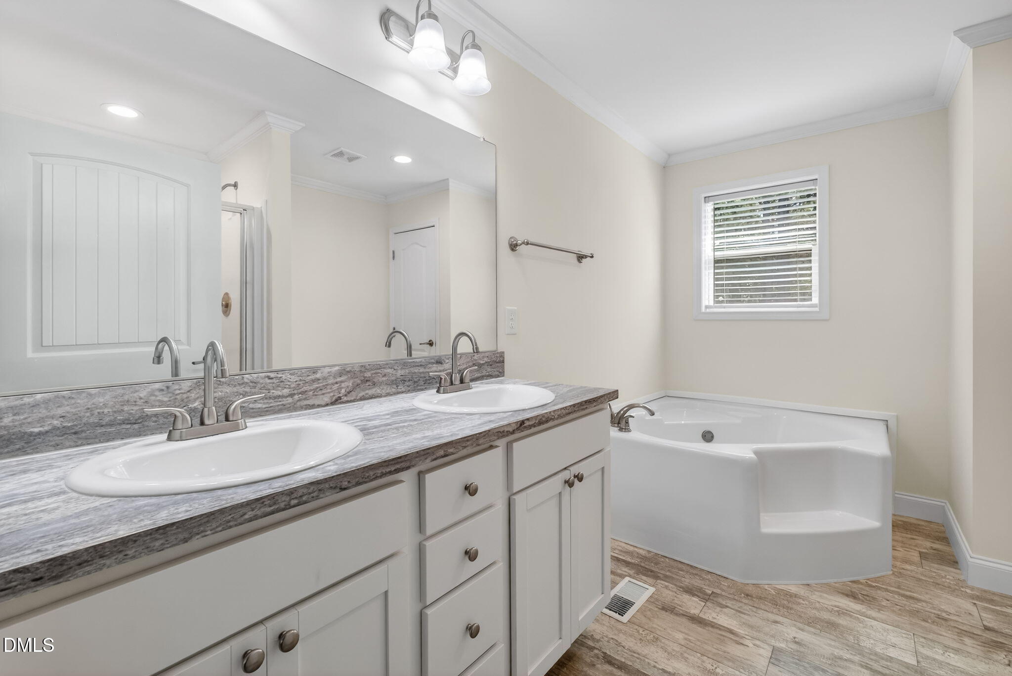 7122 Guess Road Hillsborough, NC 27278 - Photo 28 of 48 a bathroom with a granite countertop sink mirror and bathtub