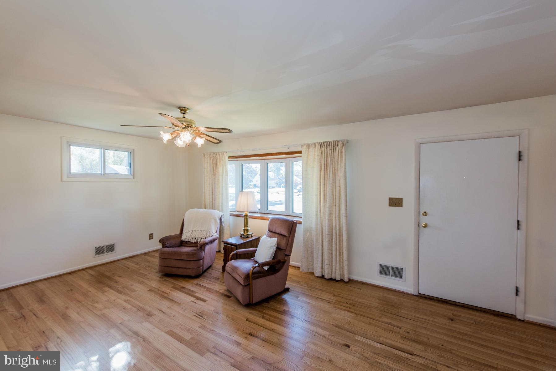 107 Ridgely Road Glen Burnie, MD 21061 - Photo 8 of 22 a living room with furniture and wooden floor