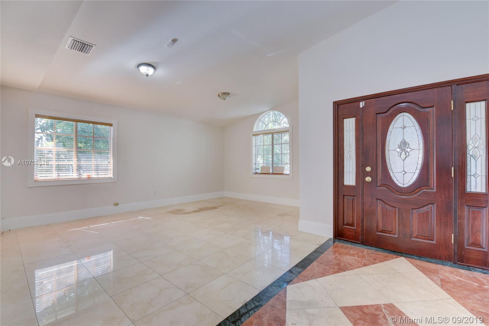 3540 Southwest 13th Street Miami, FL 33145 - Photo 6 of 27 open entryway and formal dining