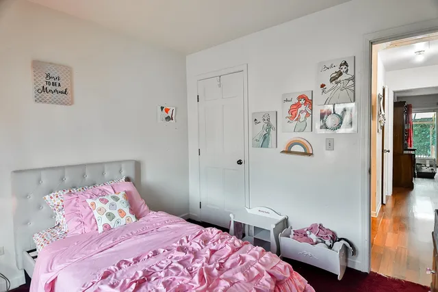 a bedroom with a bed and a couch