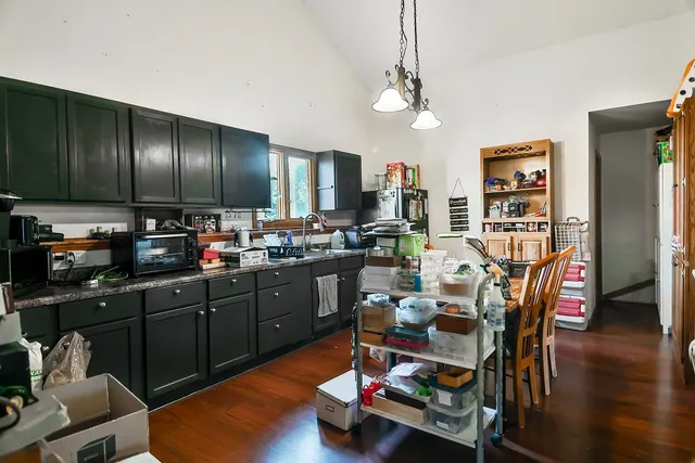 a room with lots of wooden furniture and a wooden floor