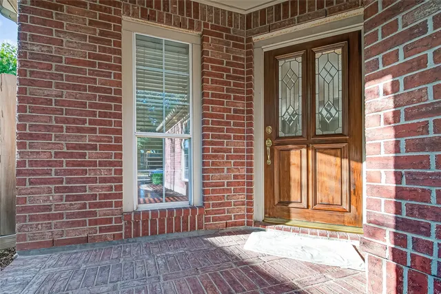 a view of a brick building with many windows