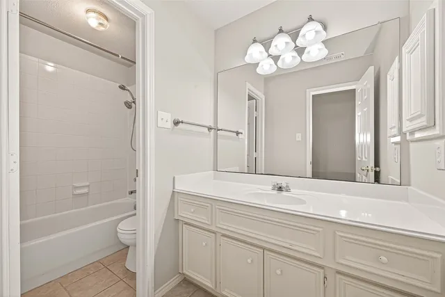 a bathroom with a shower a toilet and a shower