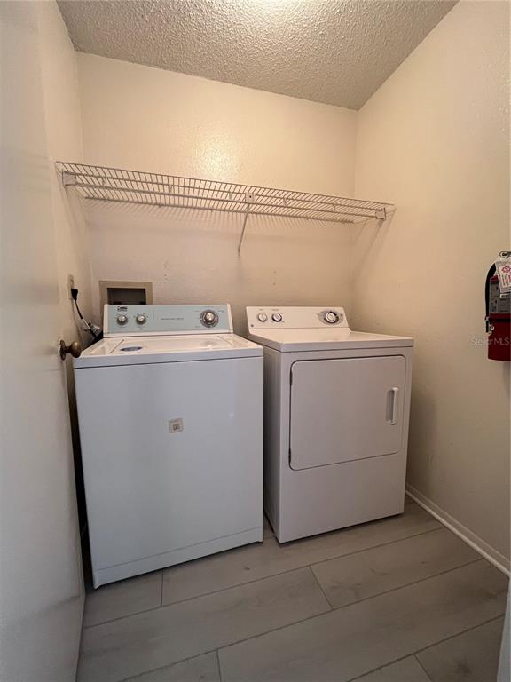623 Dory Lane, Unit 210 Altamonte Springs, FL 32714 - Photo 11 of 12 a utility room with dryer and washer