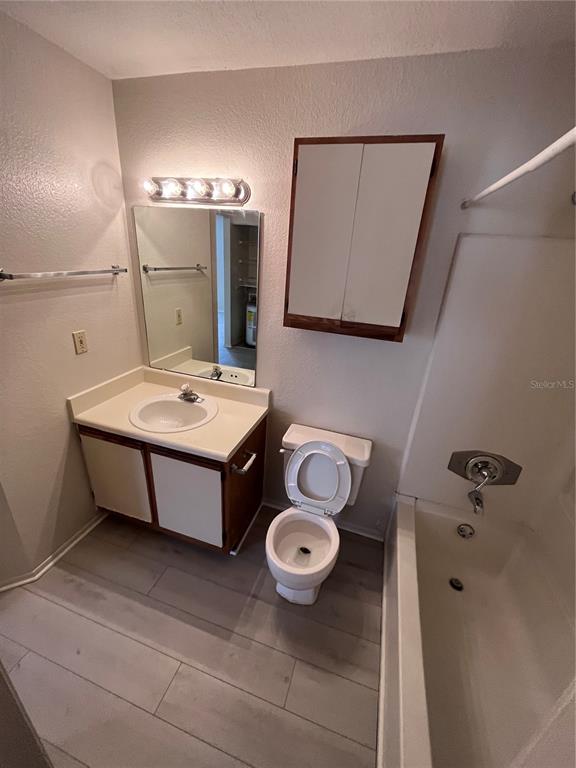 623 Dory Lane, Unit 210 Altamonte Springs, FL 32714 - Photo 7 of 12 a bathroom with a sink toilet and mirror