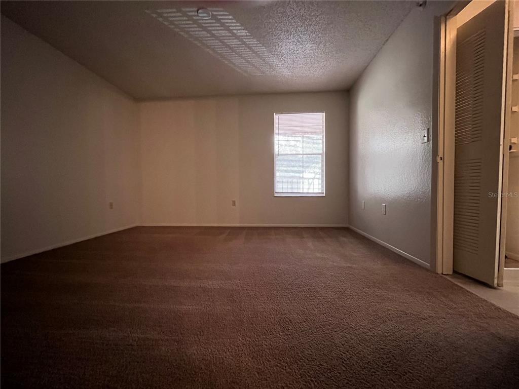 623 Dory Lane, Unit 210 Altamonte Springs, FL 32714 - Photo 8 of 12 an empty room with a window