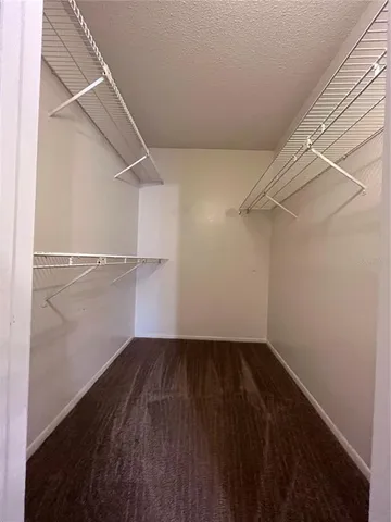 a view of an empty walk in closet