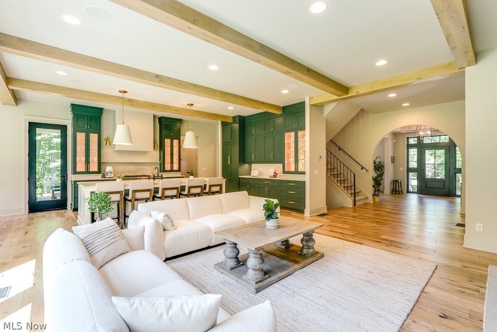 3040 Lander Road Pepper Pike, OH 44124 - Photo 5 of 38 Living room featuring beam ceiling, light wood-type flooring, and plenty of natural light