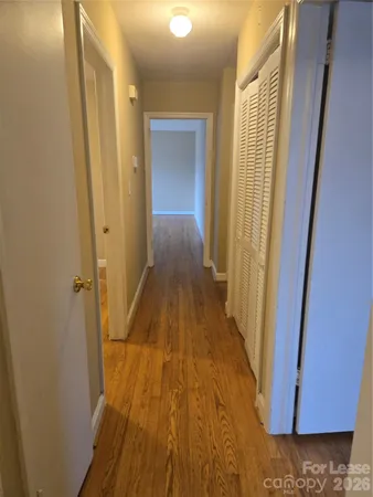 a view of a bathroom with sink and wooden floor
