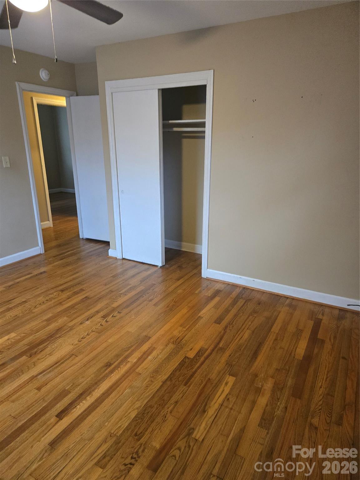 158 Crestview Street Rutherfordton, NC 28139 - Photo 13 of 15 an empty room with wooden floor and closet