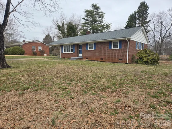 a front view of a house with yard