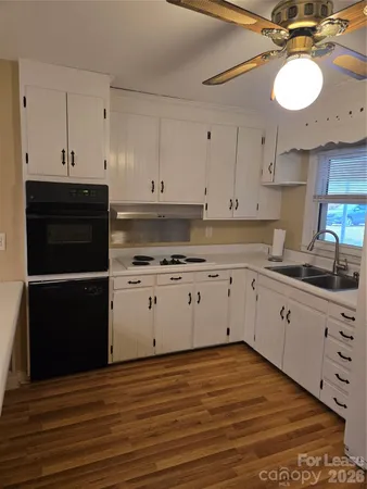 a kitchen with a cabinets and window