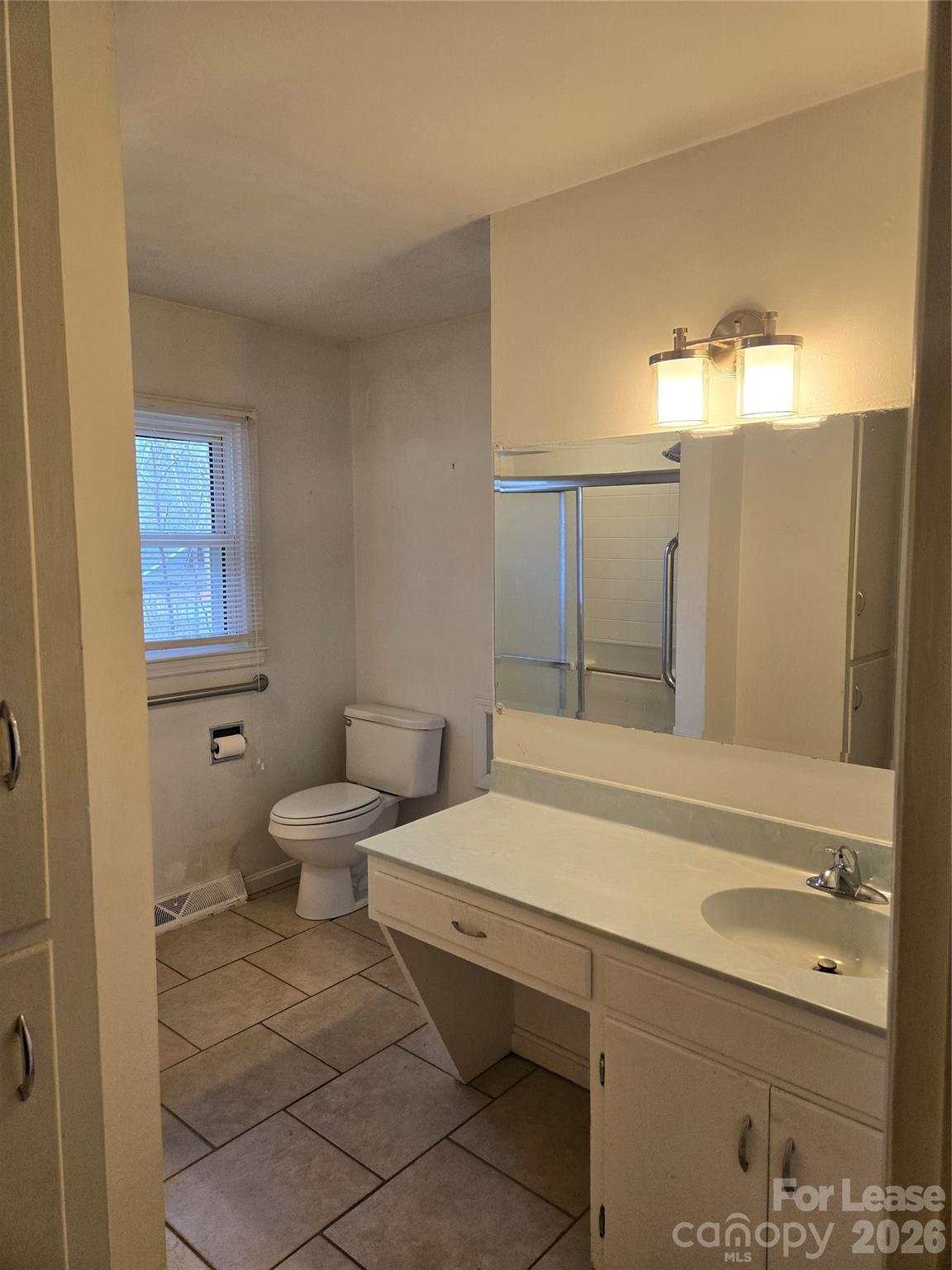 158 Crestview Street Rutherfordton, NC 28139 - Photo 9 of 15 a bathroom with a sink a toilet and mirror