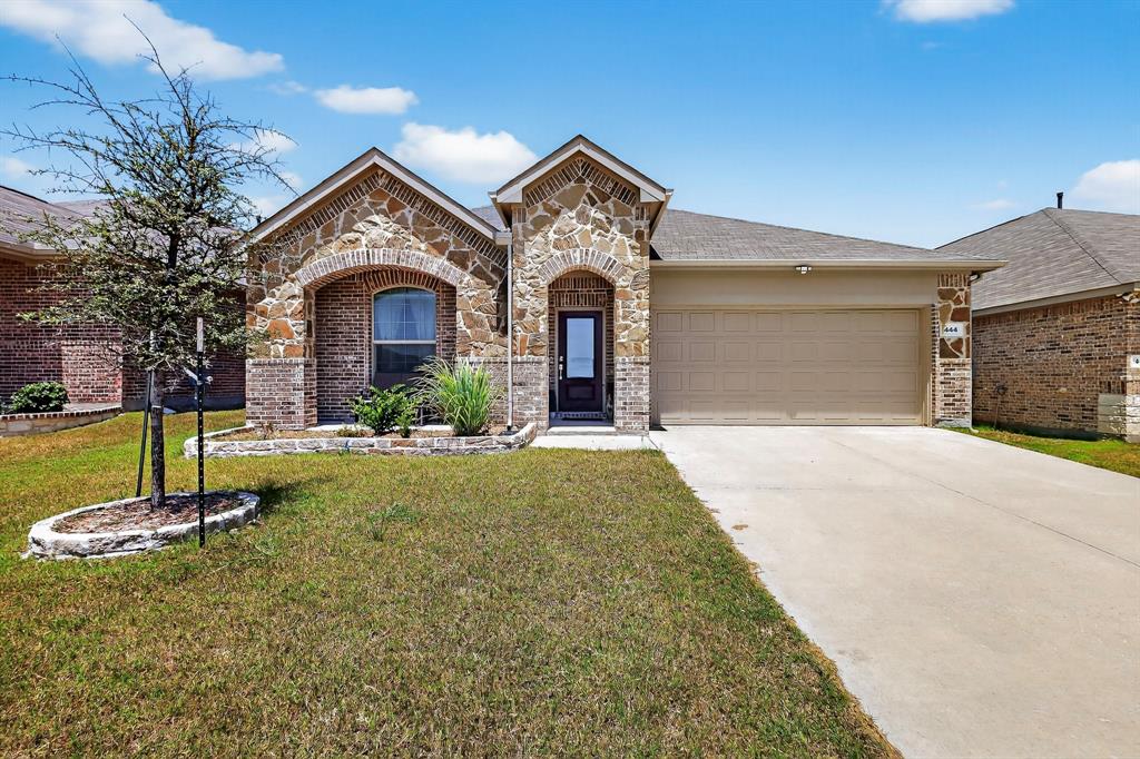 444 Ranchito Pass Fort Worth, TX 76052 - Photo 1 of 24 a front view of a house with garden