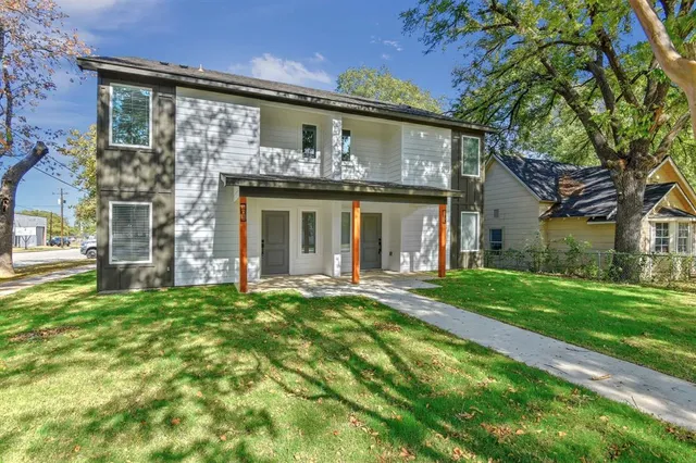 front view of a house with a yard