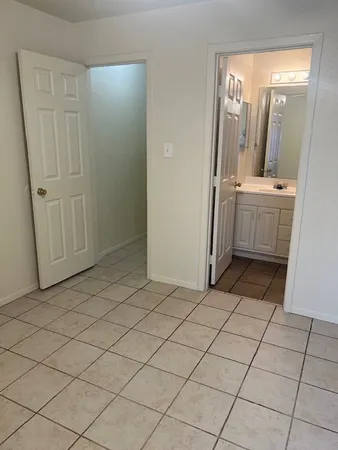 a bathroom with a sink a mirror and a shower