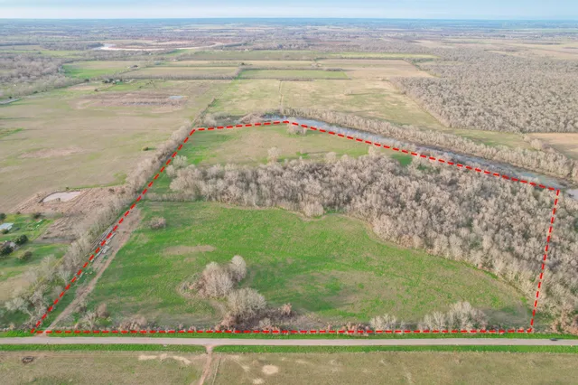 a view of a lake with a big yard