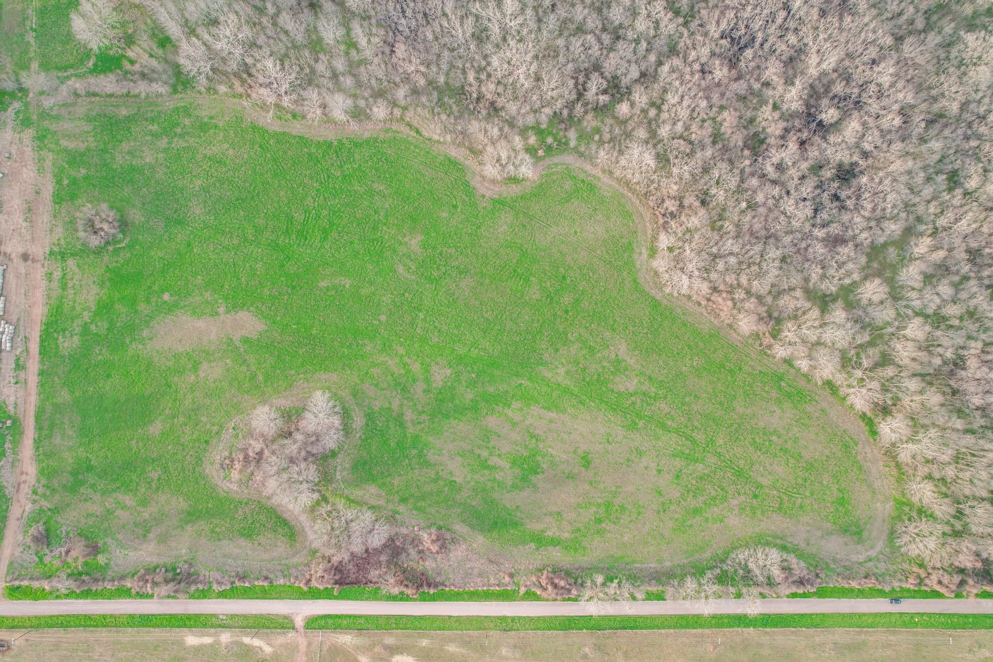0 Garrett Road Brookshire, TX 77423 - Photo 5 of 7 a backyard of a house with lots of green space