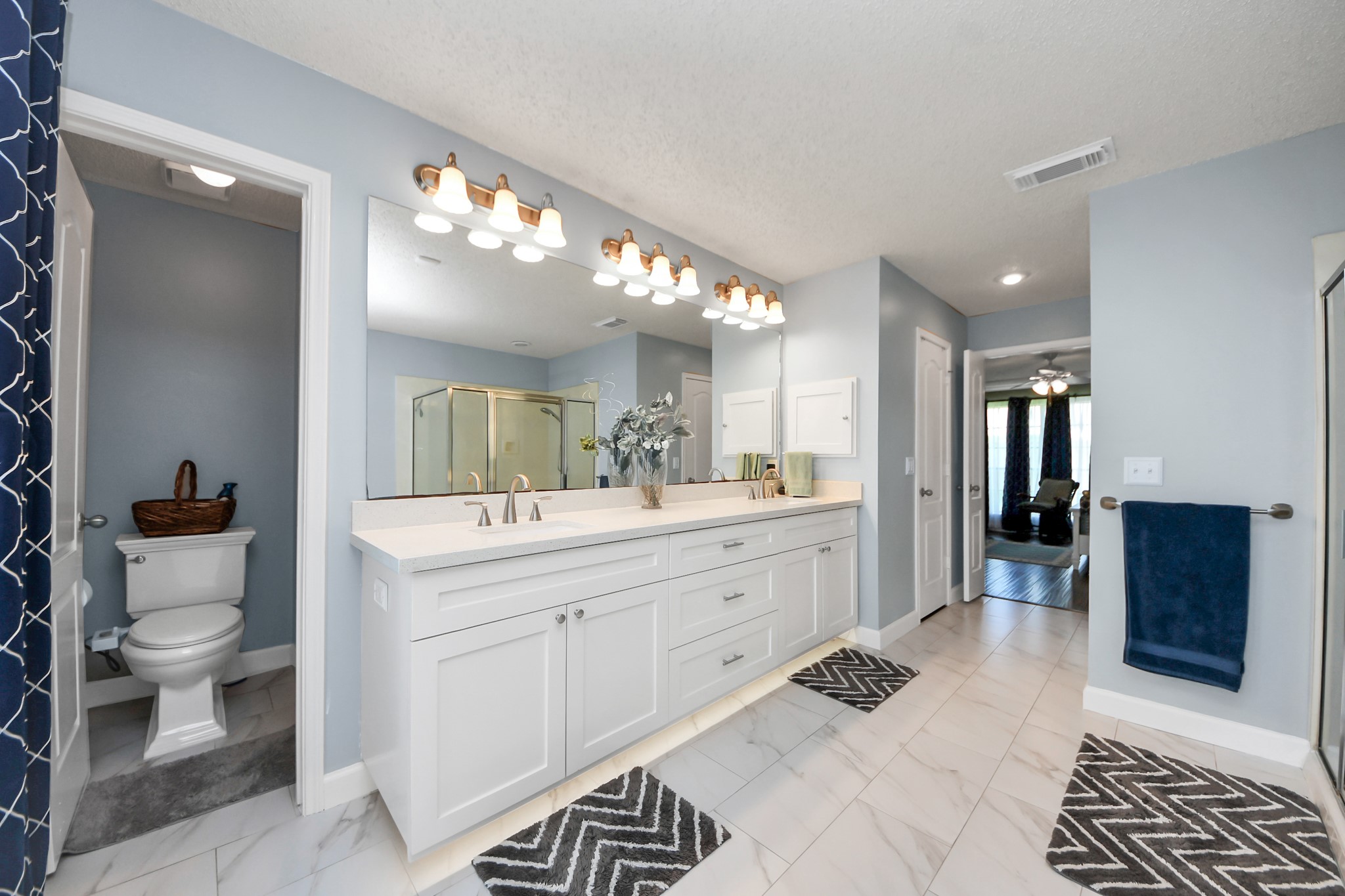 3107 Dulaney Road Houston, TX 77084 - Photo 25 of 50 a bathroom with a sink a toilet and a mirror