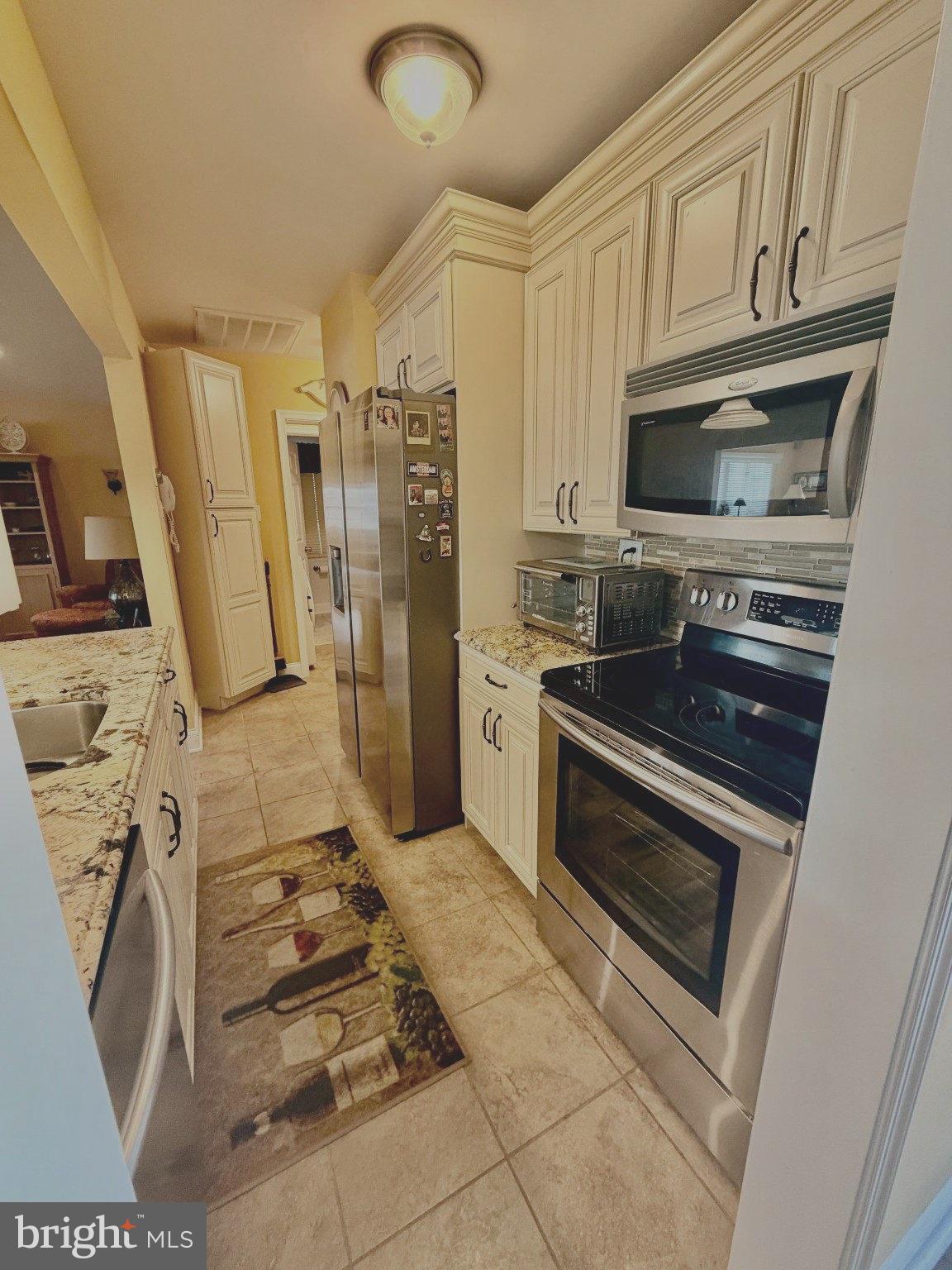211 William Cook Boulevard Manahawkin, NJ 08050 - Photo 5 of 71 Modern kitchen with elegant finishes.