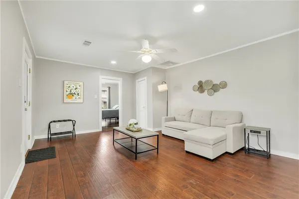 a living room with furniture and a table