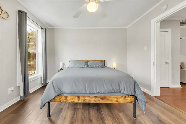 a bedroom with a bed and a window