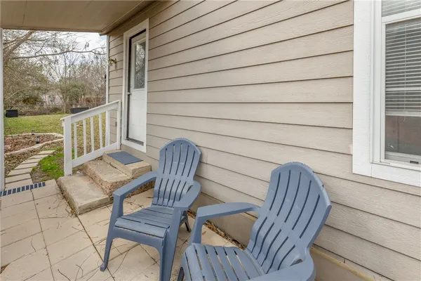 a view of balcony with wooden floor and outdoor seating