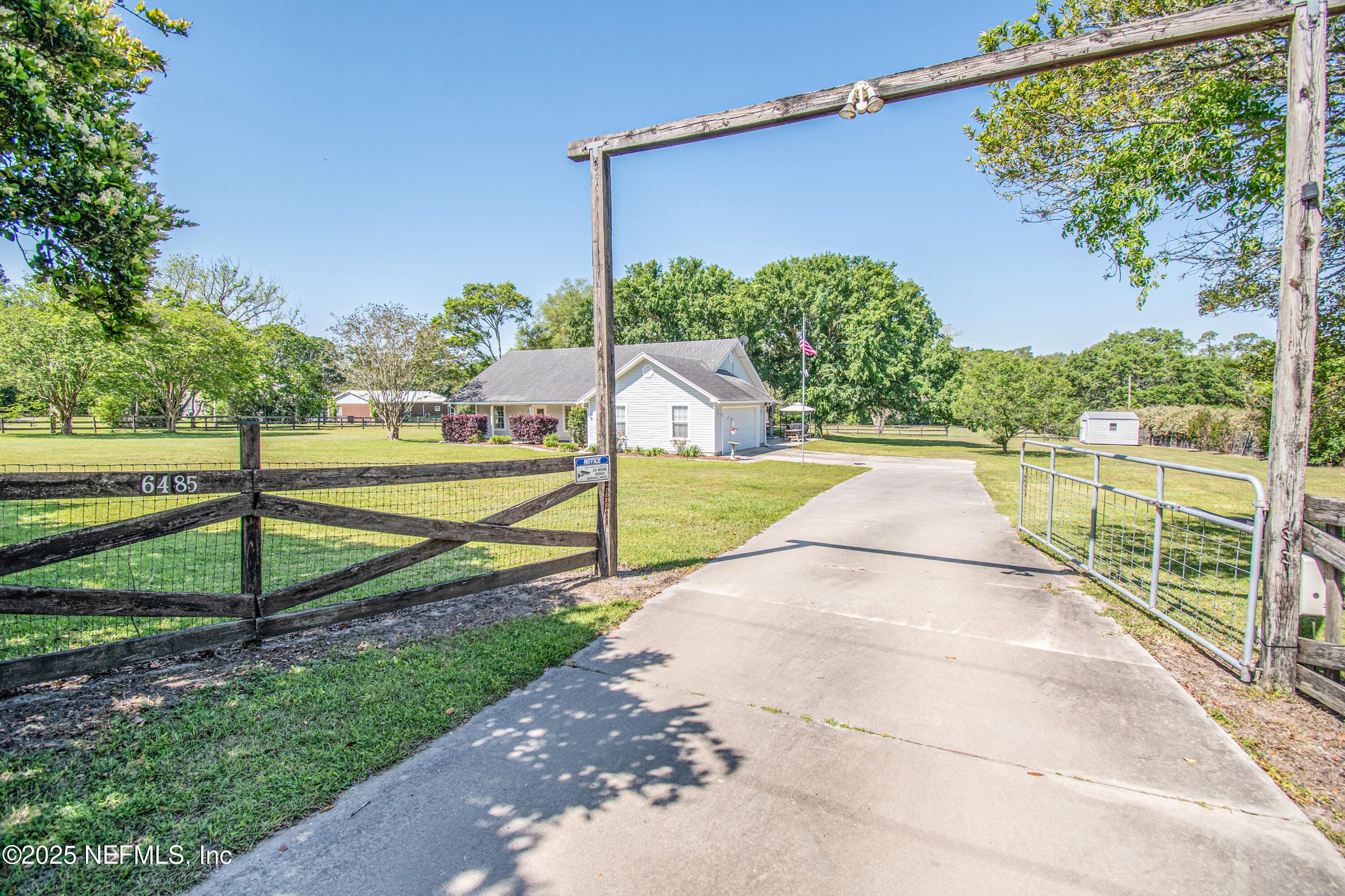 a view of a backyard with swimming pool