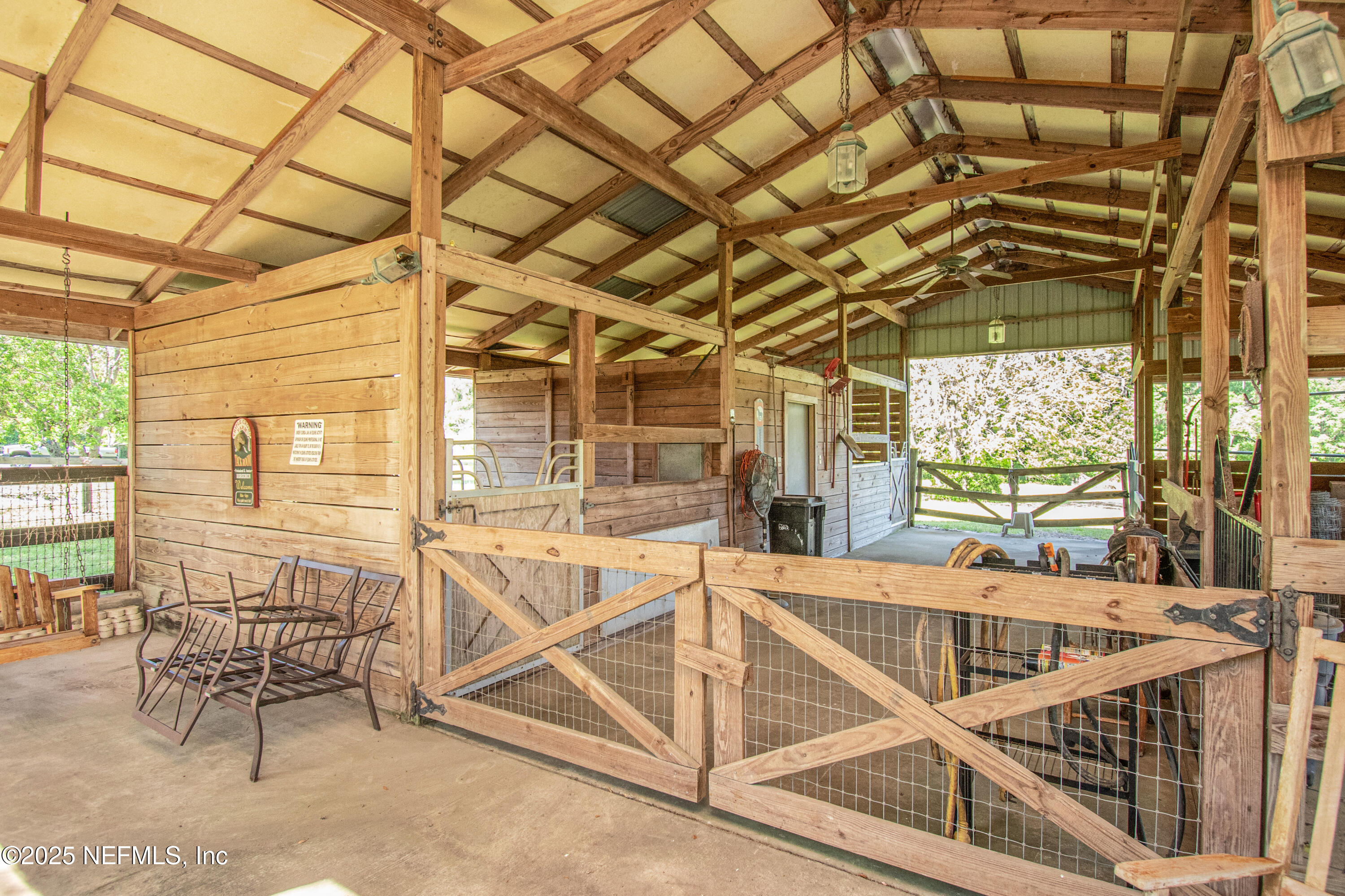 6485 Ray Phillips Road Macclenny, FL 32063 - Photo 11 of 27 a view of a porch with furniture and a yard