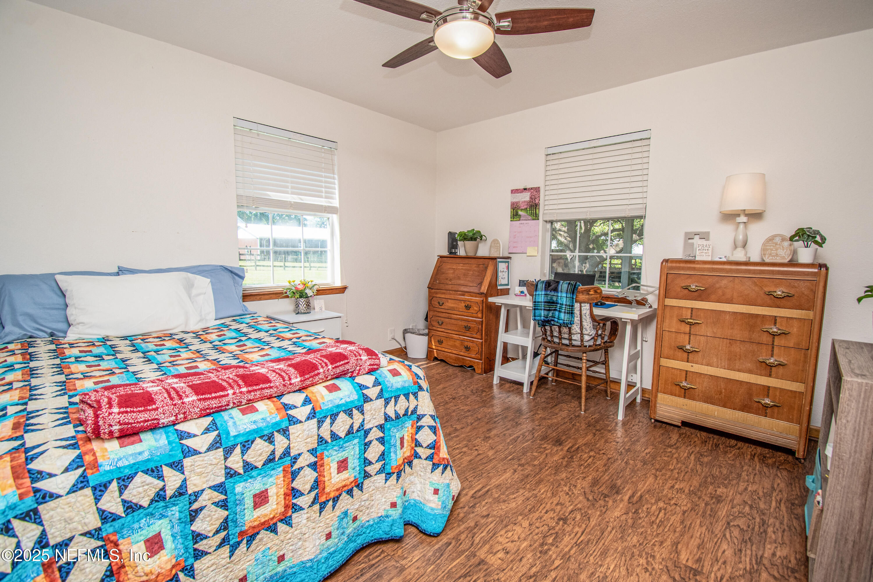 6485 Ray Phillips Road Macclenny, FL 32063 - Photo 24 of 27 a bedroom with a bed and a table in it