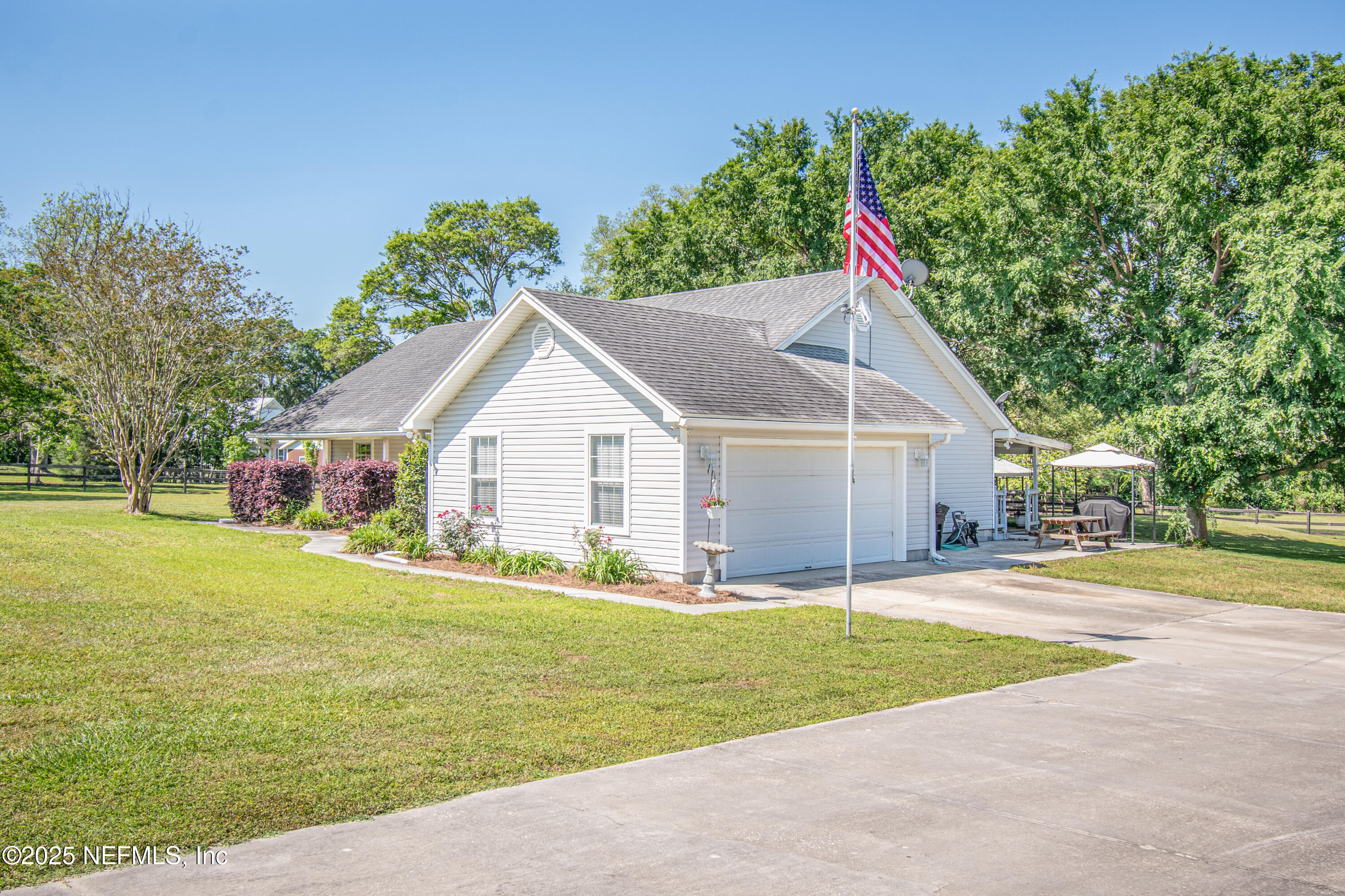 6485 Ray Phillips Road Macclenny, FL 32063 - Photo 3 of 27 a view of a house with a yard and garage