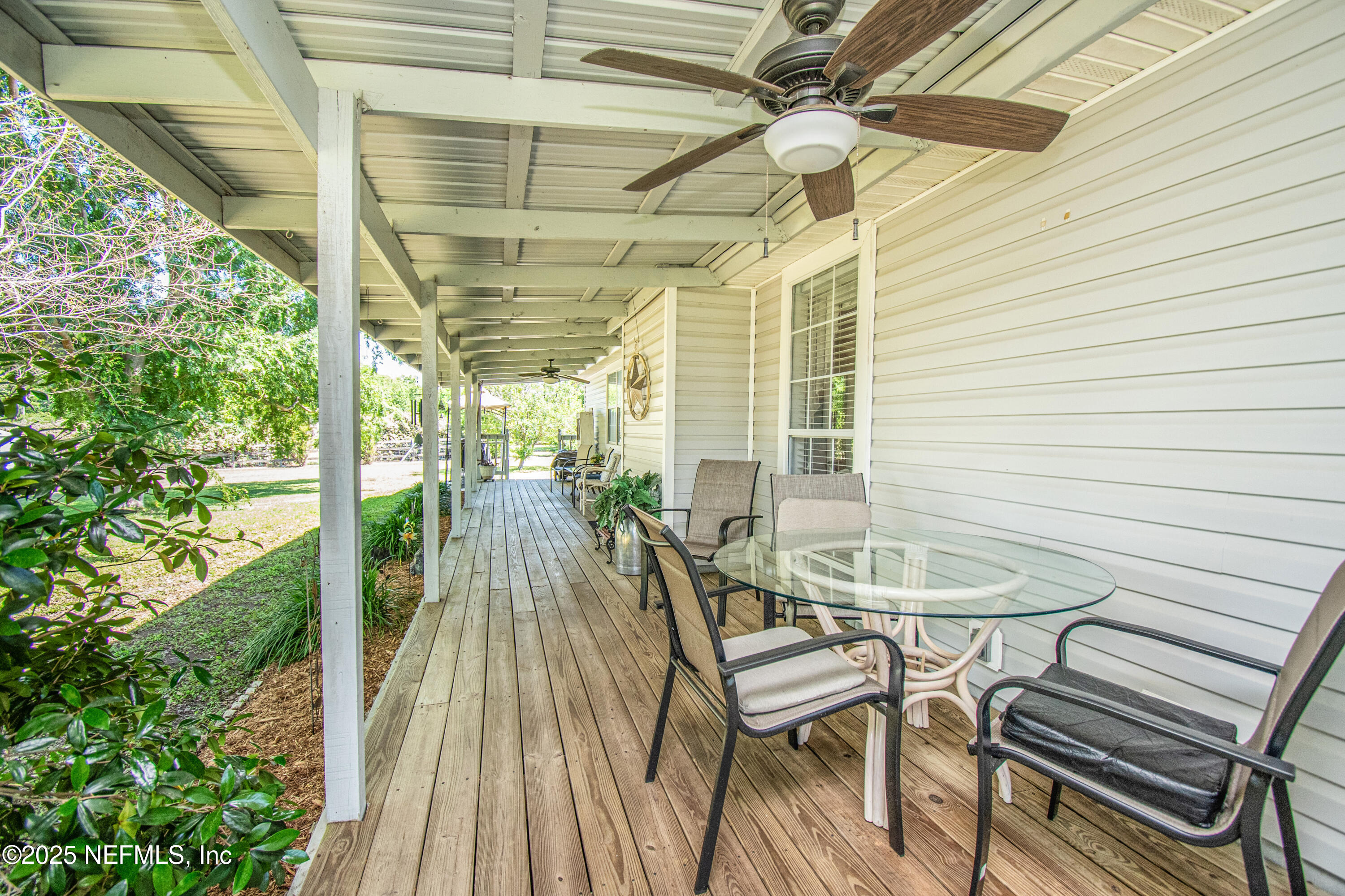 6485 Ray Phillips Road Macclenny, FL 32063 - Photo 7 of 27 a view of a room with a table and chairs