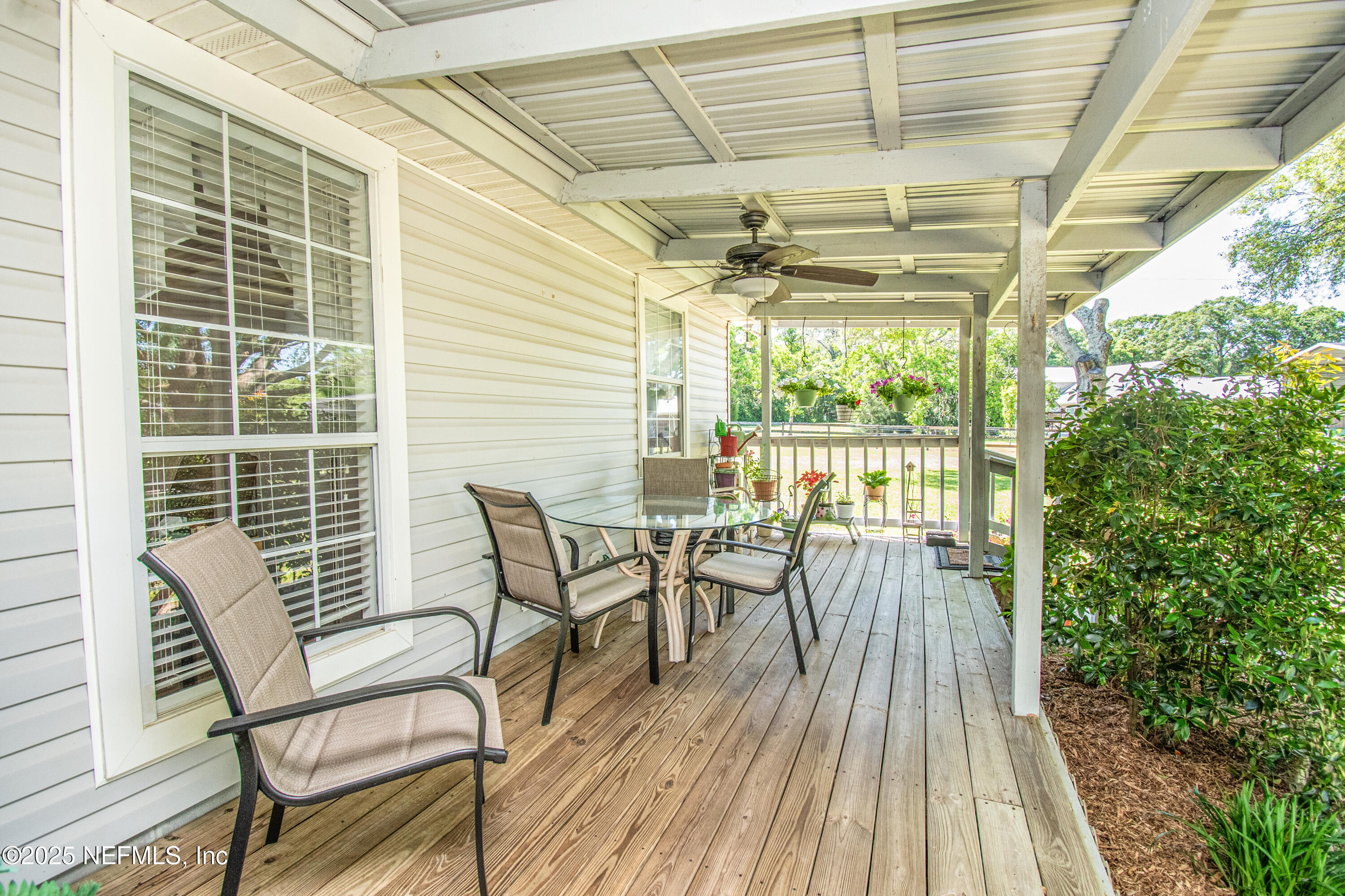 6485 Ray Phillips Road Macclenny, FL 32063 - Photo 8 of 27 a view of a dining room with furniture and wooden floor