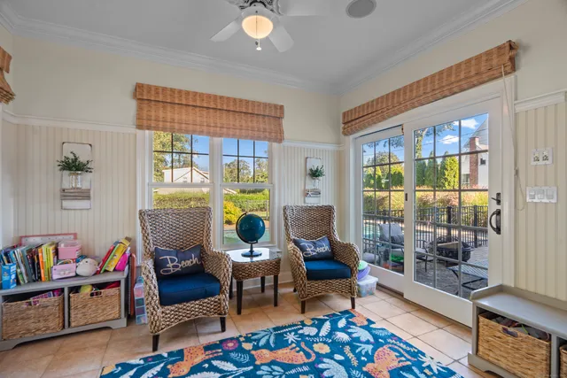 a living room filled with furniture and a rug