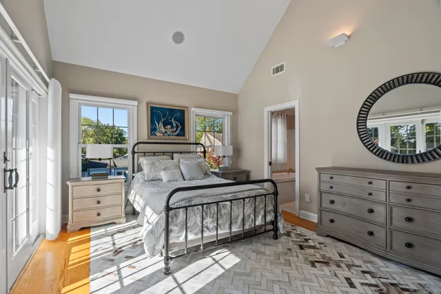 a bedroom with a bed and a dresser