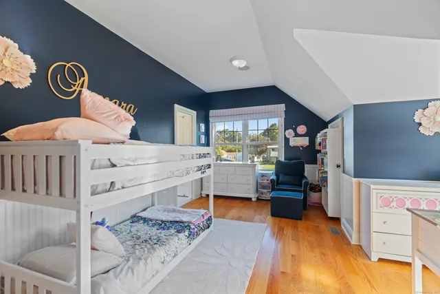 a living room with a bed and a table