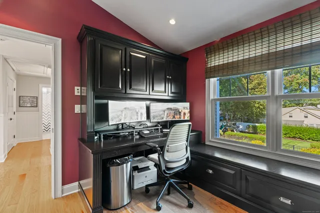 a kitchen with a stove a refrigerator and a wooden cabinets